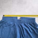 MORAJ Short running 2-en-1 turquoise/noir perforé taille S