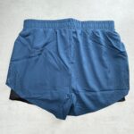 MORAJ Short running 2-en-1 turquoise/noir perforé taille S