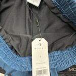 MORAJ Short running 2-en-1 turquoise/noir perforé taille S